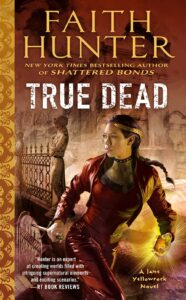 Cover of Faith Hunter's True Dead book, woman in red leather with long dark braid and gold crown